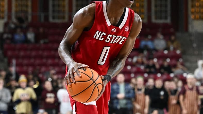 Feb 11, 2023; Chestnut Hill, Massachusetts, USA; North Carolina State Wolfpack guard Terquavion Smith (0) dribbles the ball against the Boston College Eagles during the first half at the Conte Forum. Mandatory Credit: Brian Fluharty-USA TODAY Sports