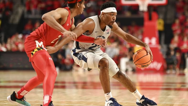 Feb 11, 2023; College Park, Maryland, USA; Penn State Nittany Lions guard Dallion Johnson (23) spins on Maryland Terrapins guard Ian Martinez (23) during the first half at Xfinity Center. Mandatory Credit: Tommy Gilligan-USA TODAY Sports