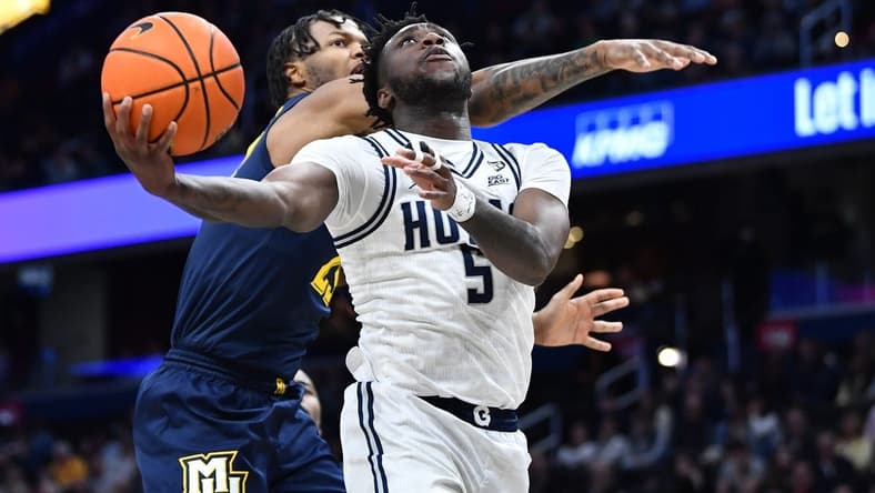 Feb 11, 2023; Washington, District of Columbia, USA; Georgetown Hoyas guard Jay Heath (5) shoots against the Marquette Golden Eagles during the first half at Capital One Arena. Mandatory Credit: Brad Mills-USA TODAY Sports