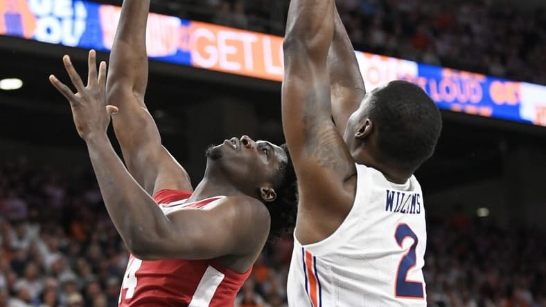 Feb 11, 2023; Auburn, Alabama, USA; Alabama Crimson Tide center Charles Bediako (14) shoots over Auburn Tigers forward Jaylin Williams (2) at Neville Arena. Mandatory Credit: Julie Bennett-USA TODAY Sports