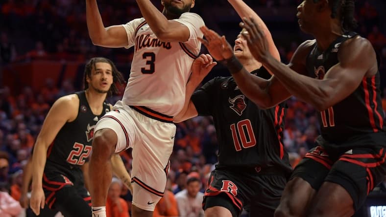 Feb 11, 2023; Champaign, Illinois, USA; Illinois Fighting Illini guard Jayden Epps (3) drives past Rutgers Scarlet Knights guard Cam Spencer (10) during the first half at State Farm Center. Mandatory Credit: Ron Johnson-USA TODAY Sports