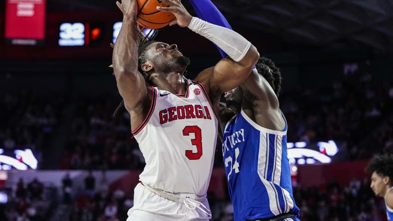 Feb 11, 2023; Athens, Georgia, USA; Georgia Bulldogs guard Kario Oquendo (3) tries to shoot defended by Kentucky Wildcats forward Chris Livingston (24) during the second half at Stegeman Coliseum. Mandatory Credit: Dale Zanine-USA TODAY Sports