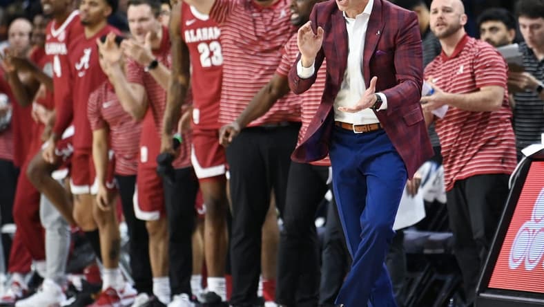 Feb 11, 2023; Auburn, Alabama, USA; Alabama Crimson Tide head coach Nate Oats cheers on the team against the Auburn Tigers at Neville Arena. Mandatory Credit: Julie Bennett-USA TODAY Sports