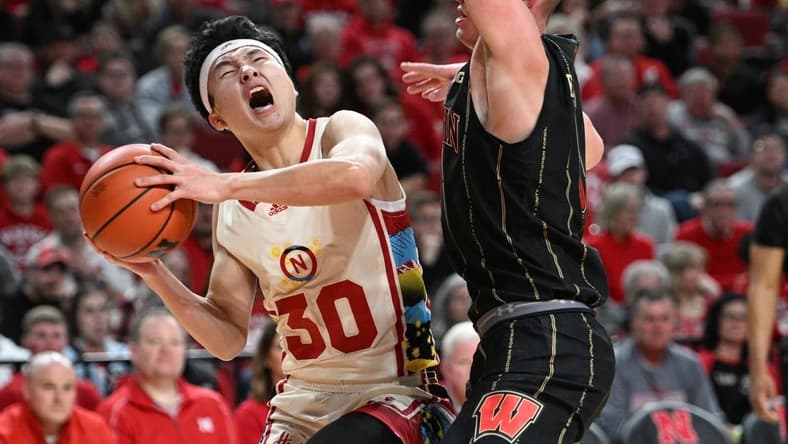 Feb 11, 2023; Lincoln, Nebraska, USA; Nebraska Cornhuskers guard Keisei Tominaga (30) reacts after being fouled by Wisconsin Badgers guard Connor Essegian (3) in the first half at Pinnacle Bank Arena. Mandatory Credit: Steven Branscombe-USA TODAY Sports
