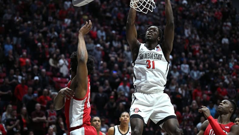Feb 11, 2023; San Diego, California, USA; San Diego State Aztecs forward Nathan Mensah (31) dunks the ball during the first half against the UNLV Rebels at Viejas Arena. Mandatory Credit: Orlando Ramirez-USA TODAY Sports