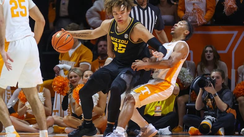 Feb 11, 2023; Knoxville, Tennessee, USA; Missouri Tigers forward Noah Carter (35) and Tennessee Volunteers guard Zakai Zeigler (5) during the first half at Thompson-Boling Arena. Mandatory Credit: Randy Sartin-USA TODAY Sports
