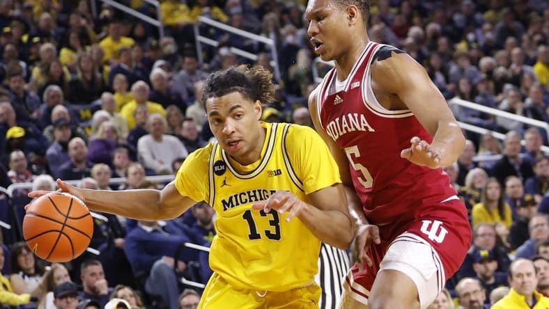 Feb 11, 2023; Ann Arbor, Michigan, USA; Michigan Wolverines guard Jett Howard (13) dribbles on Indiana Hoosiers forward Malik Reneau (5) in the first half at Crisler Center. Mandatory Credit: Rick Osentoski-USA TODAY Sports