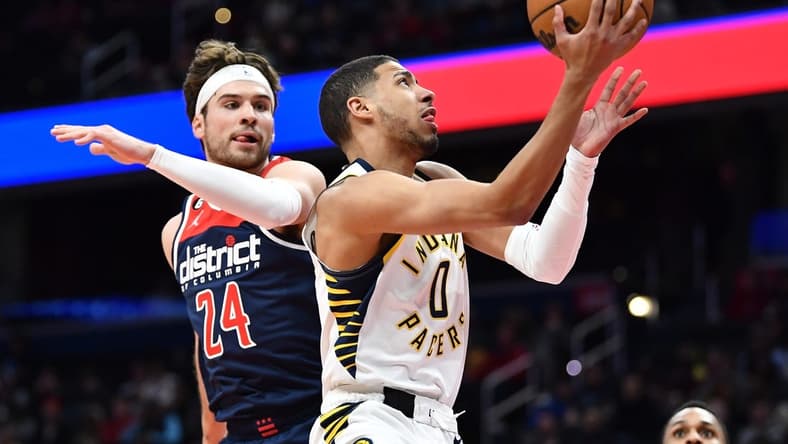 Feb 11, 2023; Washington, District of Columbia, USA; Indiana Pacers guard Tyrese Haliburton (0) shoots as Washington Wizards forward Corey Kispert (24) defends during the first half at Capital One Arena. Mandatory Credit: Brad Mills-USA TODAY Sports