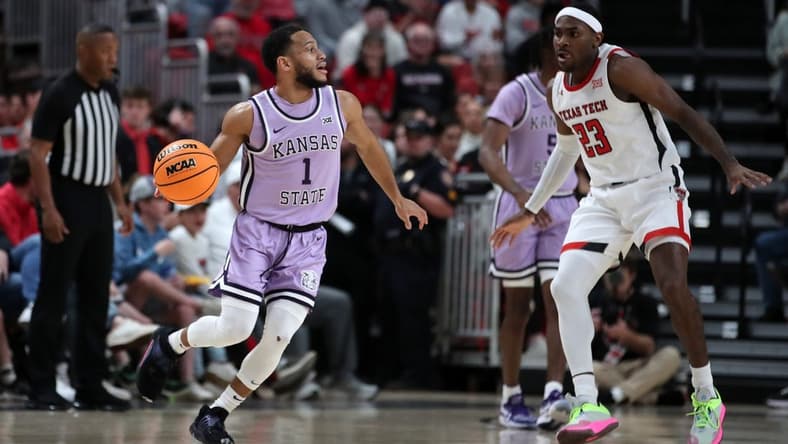 Feb 11, 2023; Lubbock, Texas, USA; Kansas State Wildcats guard Markquis Nowell (1) dribbles the ball against Texas Tech Red Raiders guard De Vion Harmon (23) in the fist half at United Supermarkets Arena. Mandatory Credit: Michael C. Johnson-USA TODAY Sports