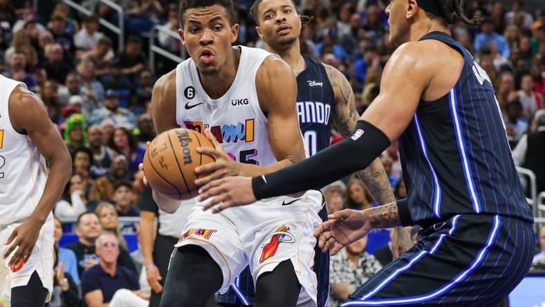 Feb 11, 2023; Orlando, Florida, USA; Miami Heat center Orlando Robinson (25) grabs the rebound during the second quarter against the Orlando Magic at Amway Center. Mandatory Credit: Mike Watters-USA TODAY Sports