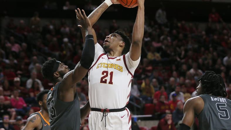 Iowa State University Cyclones center Osun Osunniyi (21) takes a shot over Oklahoma State Cowboys' forward Tyreek Smith (23) during the first half at Hilton Coliseum on Saturday, Feb. 11, 2023, in Ames, Iowa.
Oklahoma State And Iowa State Men S Basketball