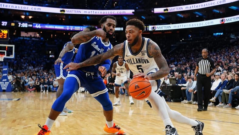 Feb 11, 2023; Philadelphia, Pennsylvania, USA; Villanova Wildcats guard Justin Moore (5) dribbles the ball against Seton Hall Pirates guard Jamir Harris (15) during the second half at Wells Fargo Center. Mandatory Credit: Gregory Fisher-USA TODAY Sports