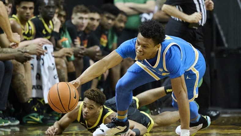 Feb 11, 2023; Eugene, Oregon, USA; UCLA Bruins guard Jaylen Clark (0) steals the basketball during the second half against Oregon Ducks guard Keeshawn Barthelemy (3) at Matthew Knight Arena. Mandatory Credit: Troy Wayrynen-USA TODAY Sports