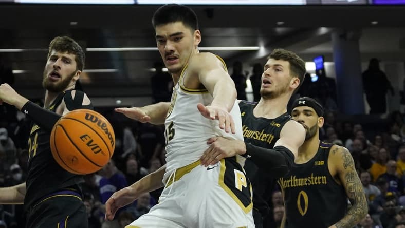 Feb 12, 2023; Evanston, Illinois, USA; Northwestern Wildcats forward Robbie Beran (31) and Purdue Boilermakers center Zach Edey (15) go for the ball during the first half at Welsh-Ryan Arena. Mandatory Credit: David Banks-USA TODAY Sports