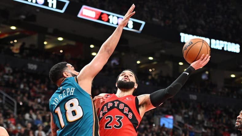 Feb 12, 2023; Toronto, Ontario, CAN; Toronto Raptors guard Fred VanVleet (23) is fouled as he shoots the ball by Detroit Pistons guard Cory Joseph (18) in the first half at Scotiabank Arena. Mandatory Credit: Dan Hamilton-USA TODAY Sports