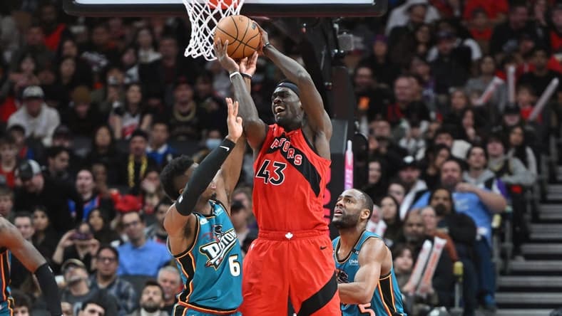 Feb 12, 2023; Toronto, Ontario, CAN;    Toronto Raptors forward Pascal Siakam (43) holds the ball away from Detroit Pistons guards Hamidou Diallo (6) and Alec Burks (5) in the second half at Scotiabank Arena. Mandatory Credit: Dan Hamilton-USA TODAY Sports
