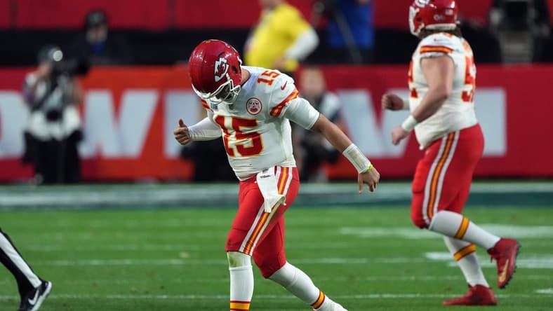 Feb 12, 2023; Glendale, Arizona, US; Kansas City Chiefs quarterback Patrick Mahomes (15) reacts an apparent injury after a play in the second quarter of Super Bowl LVII at State Farm Stadium. Mandatory Credit: Joe Camporeale-USA TODAY Sports