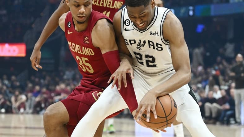 Feb 13, 2023; Cleveland, Ohio, USA; Cleveland Cavaliers forward Isaac Okoro (35) and San Antonio Spurs guard Malaki Branham (22) fight for the ball during the first half at Rocket Mortgage FieldHouse. Mandatory Credit: Ken Blaze-USA TODAY Sports
