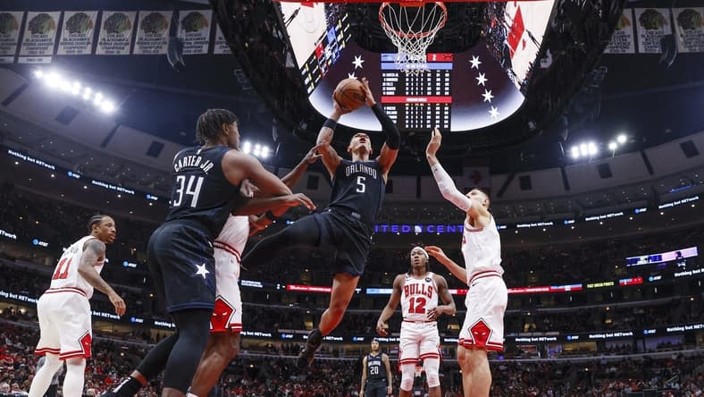 Feb 13, 2023; Chicago, Illinois, USA; Orlando Magic forward Paolo Banchero (5) goes to the basket against the Chicago Bulls during the first half at United Center. Mandatory Credit: Kamil Krzaczynski-USA TODAY Sports