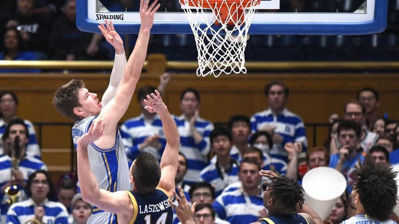 Feb 14, 2023; Durham, North Carolina, USA; Duke Blue Devils center Kyle Filipowski(30) shoots over Notre Dame Fighting Irish forward Nate Laszewski (14) during the first half at Cameron Indoor Stadium. Mandatory Credit: Rob Kinnan-USA TODAY Sports