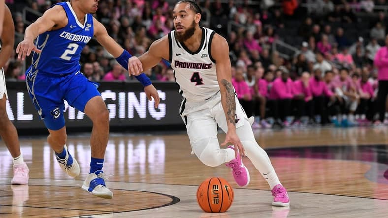 Feb 14, 2023; Providence, Rhode Island, USA; Providence Friars guard Jared Bynum (4) works to drive by Creighton Bluejays guard Ryan Nembhard (2) during the first half at Amica Mutual Pavilion. Mandatory Credit: Eric Canha-USA TODAY Sports