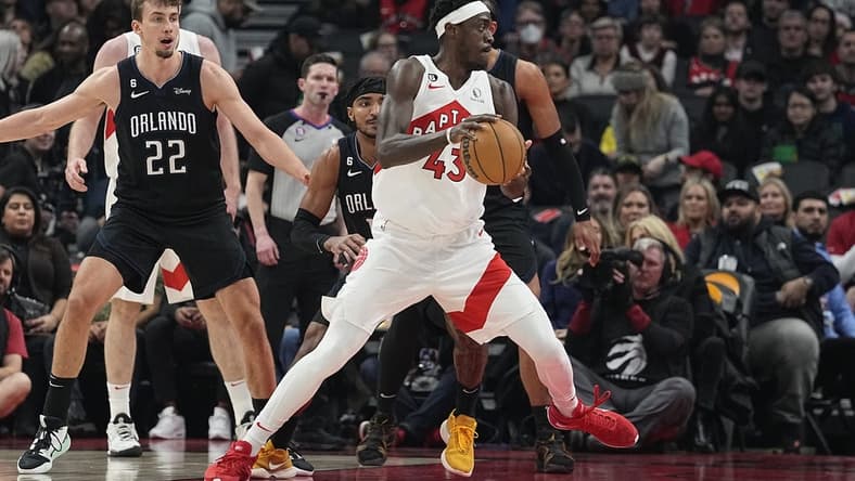Feb 14, 2023; Toronto, Ontario, CAN; Toronto Raptors forward Pascal Siakam (43) drives to the net past Orlando Magic forward Franz Wagner (22) during the first half at Scotiabank Arena. Mandatory Credit: John E. Sokolowski-USA TODAY Sports