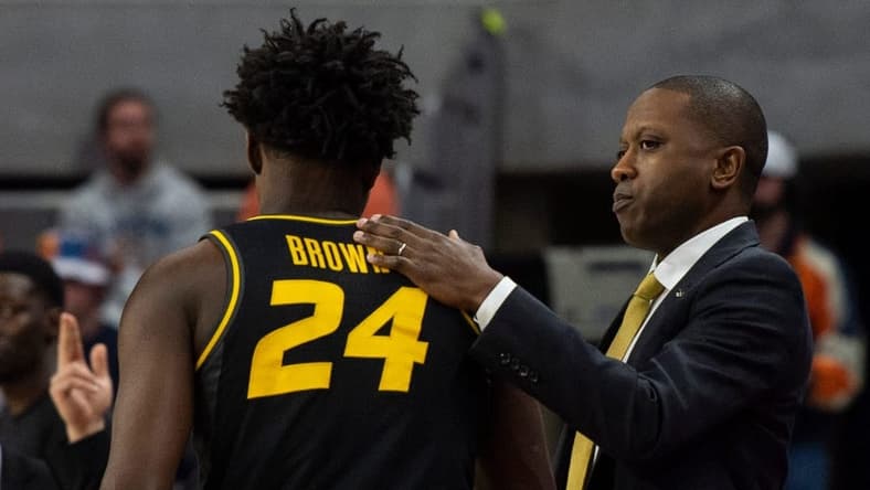 Missouri Tigers head coach Dennis Gates greets Missouri Tigers guard Kobe Brown (24) on the sideline as Auburn Tigers take on Missouri Tigers at Neville Arena in Auburn, Ala., on Tuesday, Feb. 14, 2023. Auburn Tigers lead Missouri Tigers 45-18 at halftime.