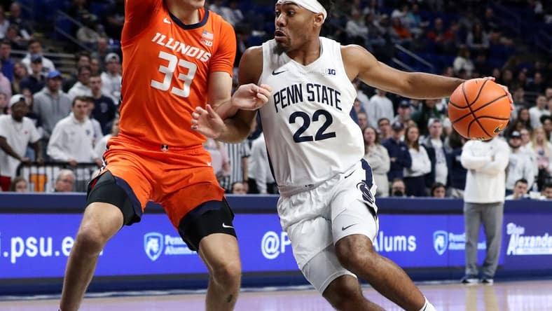 Feb 14, 2023; University Park, Pennsylvania, USA; Penn State Nittany Lions guard Jalen Pickett (22) dribbles the ball towards the basket as Illinois Fighting Illini forward Coleman Hawkins (33) defends during the first half at Bryce Jordan Center. Mandatory Credit: Matthew OHaren-USA TODAY Sports