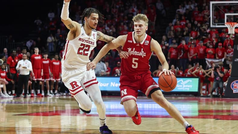 Feb 14, 2023; Piscataway, New Jersey, USA; Nebraska Cornhuskers guard Sam Griesel (5) dribbles against Rutgers Scarlet Knights guard Caleb McConnell (22) during the first half at Jersey Mike's Arena. Mandatory Credit: Vincent Carchietta-USA TODAY Sports