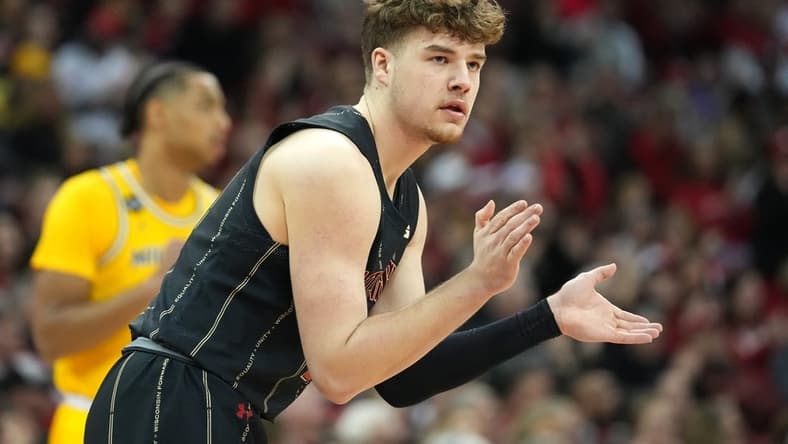 Feb 14, 2023; Madison, Wisconsin, USA; Wisconsin Badgers guard Max Klesmit (11) celebrates scoring a basket during the first half against the Michigan Wolverines at the Kohl Center. Mandatory Credit: Kayla Wolf-USA TODAY Sports