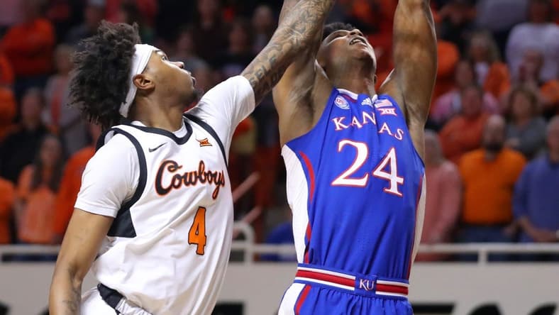 Kansas Jayhawks forward K.J. Adams Jr. (24) dunks the ball beside Oklahoma State Cowboys guard Woody Newton (4) during a men's college basketball game between the Oklahoma State University Cowboys and the Kansas Jayhawks at Gallagher-Iba Arena in Stillwater, Okla., Tuesday, Feb. 14, 2023.
Osu Vs Kansas Basketball
