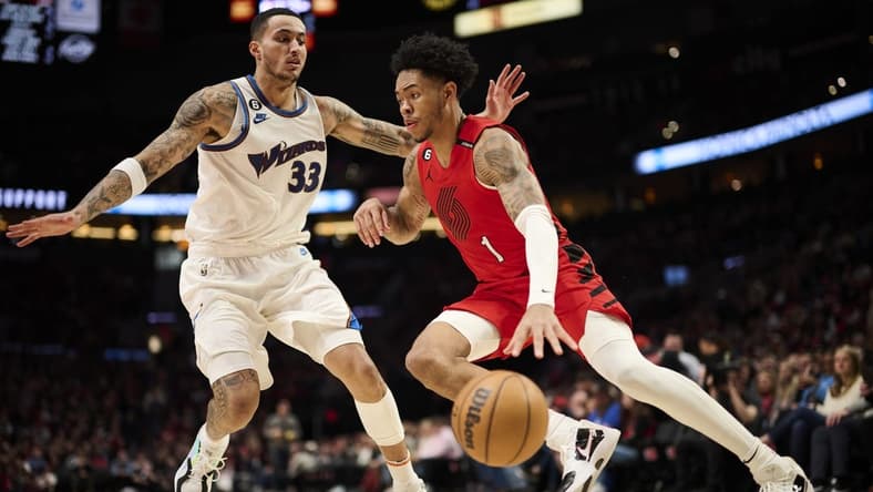 Feb 14, 2023; Portland, Oregon, USA; Portland Trail Blazers guard Anfernee Simons (1) drives to the basket during the second half against Washington Wizards forward Kyle Kuzma (33) at Moda Center. Mandatory Credit: Troy Wayrynen-USA TODAY Sports