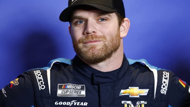 Feb 15, 2023; Daytona Beach, Florida, USA; NASCAR Cup Series driver Conor Daly (50) speaks to the media at Daytona International Speedway. Mandatory Credit: Mike Dinovo-USA TODAY Sports