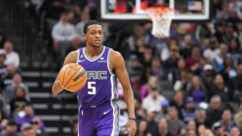 Feb 11, 2023; Sacramento, California, USA; Sacramento Kings guard De'Aaron Fox (5) dribbles against the Dallas Mavericks during the fourth quarter at Golden 1 Center. Mandatory Credit: Darren Yamashita-USA TODAY Sports