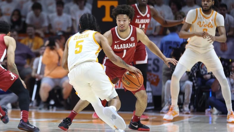 Feb 15, 2023; Knoxville, Tennessee, USA; Alabama Crimson Tide guard Mark Sears (1) defends Tennessee Volunteers guard Zakai Zeigler (5) at Thompson-Boling Arena. Mandatory Credit: Randy Sartin-USA TODAY Sports