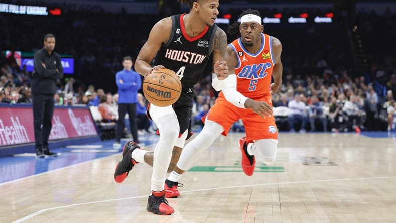 Feb 15, 2023; Oklahoma City, Oklahoma, USA; Houston Rockets guard Jalen Green (4) drives down the court ahead of Oklahoma City Thunder guard Luguentz Dort (5) during the first quarter at Paycom Center. Mandatory Credit: Alonzo Adams-USA TODAY Sports