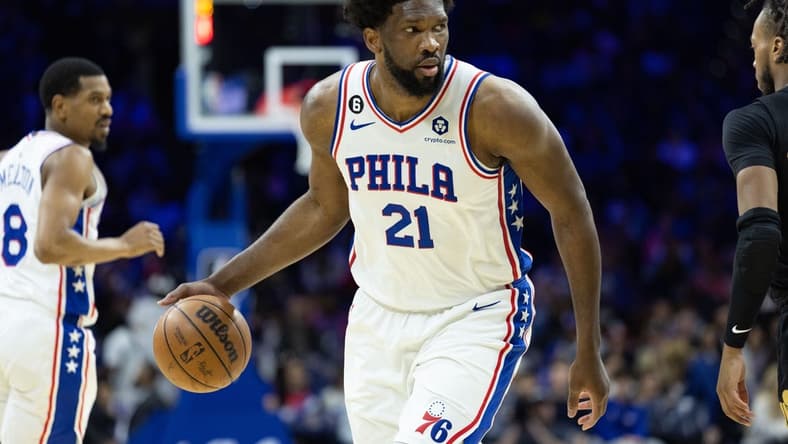 Feb 15, 2023; Philadelphia, Pennsylvania, USA; Philadelphia 76ers center Joel Embiid (21) dribbles the ball against the Cleveland Cavaliers during the third quarter at Wells Fargo Center. Mandatory Credit: Bill Streicher-USA TODAY Sports