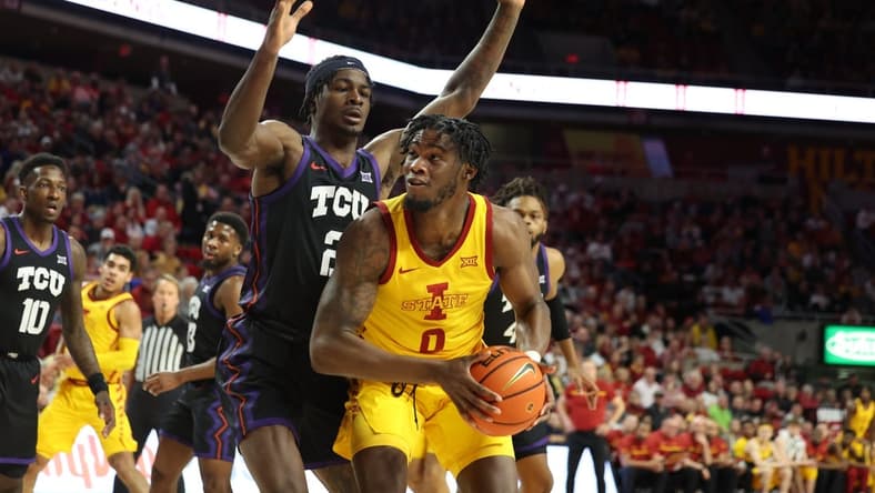 Feb 15, 2023; Ames, Iowa, USA; TCU Horned Frogs forward Emanuel Miller (2) loclkls down Iowa State Cyclones forward Tre King (0) during the first half at James H. Hilton Coliseum. Mandatory Credit: Reese Strickland-USA TODAY Sports