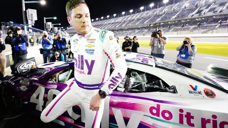 Feb 15, 2023; Daytona Beach, Florida, USA; NASCAR Cup Series driver Alex Bowman (48) exits his car as he celebrates winning the pole during qualifying at Daytona International Speedway. Mandatory Credit: John David Mercer-USA TODAY Sports