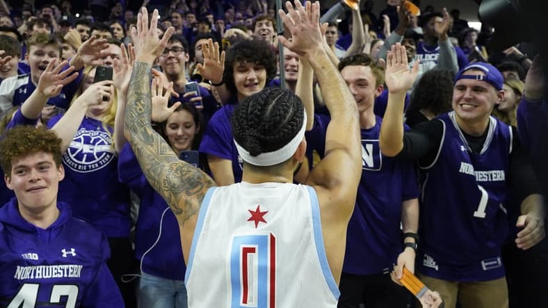 Feb 15, 2023; Evanston, Illinois, USA; Northwestern Wildcats guard Boo Buie (0) celebrates his game winning shot against the Indiana Hoosiers at Welsh-Ryan Arena. Mandatory Credit: David Banks-USA TODAY Sports