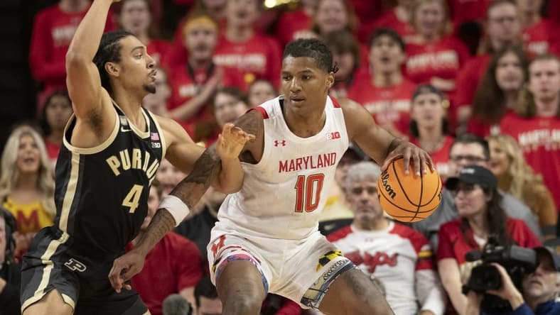 Feb 16, 2023; College Park, Maryland, USA;  Maryland Terrapins forward Julian Reese (10) dribbles as Purdue Boilermakers forward Trey Kaufman-Renn (4) defends during the first half at Xfinity Center. Mandatory Credit: Tommy Gilligan-USA TODAY Sports