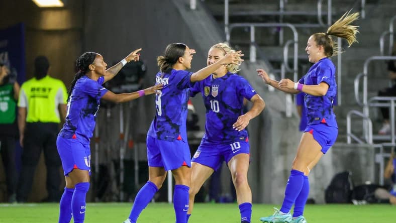 Feb 16, 2023; Orlando, Florida, USA; USA forward Mallory Swanson (9) celebrates with teammates after scoring a goal during the first half against Canada at Exploria Stadium. Mandatory Credit: Mike Watters-USA TODAY Sports
