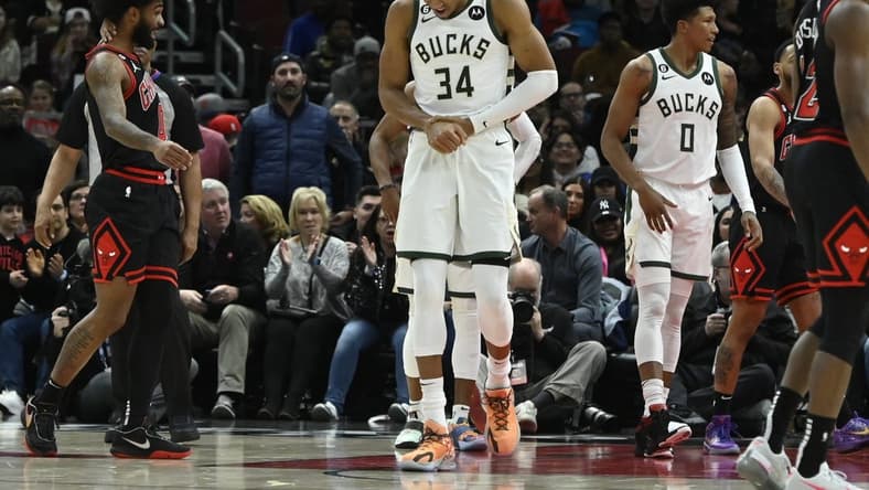 Feb 16, 2023; Chicago, Illinois, USA; Milwaukee Bucks forward Giannis Antetokounmpo (34) holds his wrist after colliding with Chicago Bulls guard Coby White (not pictured) during the first half at the United Center. Mandatory Credit: Matt Marton-USA TODAY Sports