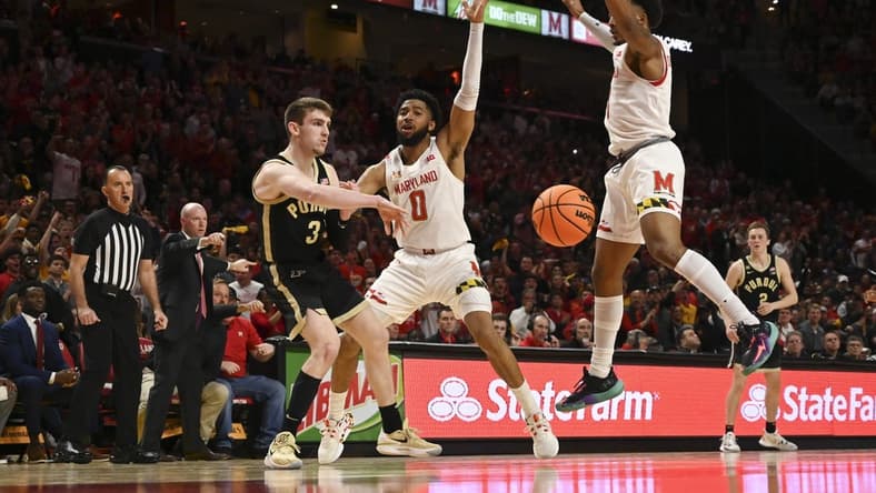Feb 16, 2023; College Park, Maryland, USA; Purdue Boilermakers guard Braden Smith (3) attempts to pass around Maryland Terrapins guard Don Carey (0) and guard Jahmir Young (1) during the second half at Xfinity Center. Maryland Terrapins defeated Purdue Boilermakers 68-54. Mandatory Credit: Tommy Gilligan-USA TODAY Sports