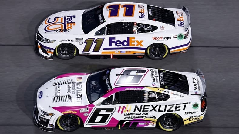 Feb 16, 2023; Daytona Beach, Florida, USA; NASCAR Cup Series driver Brad Keselowski (6) and driver Denny Hamlin (11) race side by side during Duel 2 at Daytona International Speedway. Mandatory Credit: Mike Dinovo-USA TODAY Sports