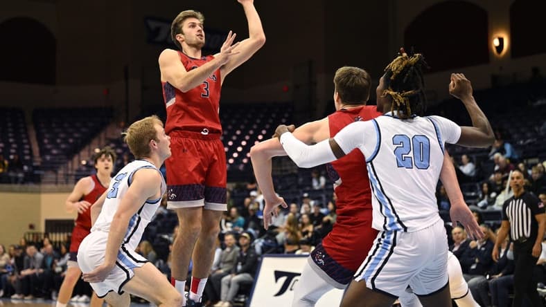 Feb 16, 2023; San Diego, California, USA; Saint Mary's Gaels guard Augustas Marciulionis (3) shoots the ball over San Diego Toreros guard Dominic Muncey (32) during the first half at Jenny Craig Pavilion. Mandatory Credit: Orlando Ramirez-USA TODAY Sports