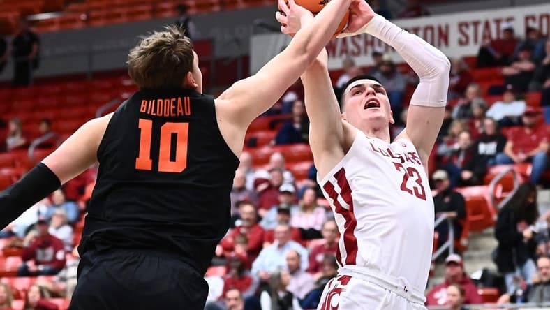 Feb 16, 2023; Pullman, Washington, USA; Washington State Cougars forward Andrej Jakimovski (23) shoots the ball against Oregon State Beavers forward Tyler Bilodeau (10) in the second half at Friel Court at Beasley Coliseum. Washington State won 80-62. Mandatory Credit: James Snook-USA TODAY Sports