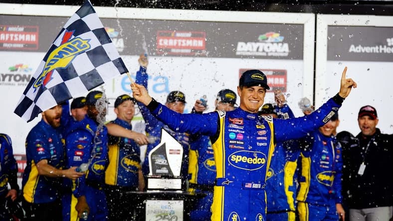 Feb 17, 2023; Daytona Beach, Florida, USA; NASCAR Truck Series driver Zane Smith (38) celebrates in victory lane after being declared the winner following a rain shortened NextEra Energy 250 race at Daytona International Speedway. Mandatory Credit: John David Mercer-USA TODAY Sports