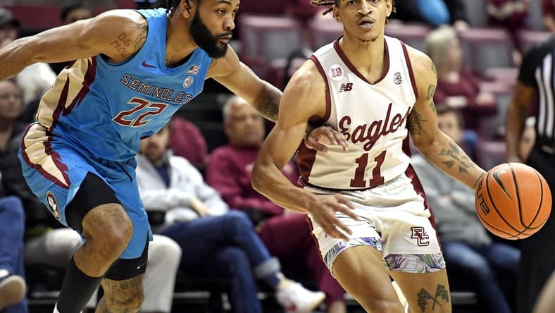 Feb 18, 2023; Tallahassee, Florida, USA; Boston College Eagles guard Makai Ashton-Langford (11) drives to the net past Florida State Seminoles guard Darin Green Jr (22) during the first half at Donald L. Tucker Center. Mandatory Credit: Melina Myers-USA TODAY Sports