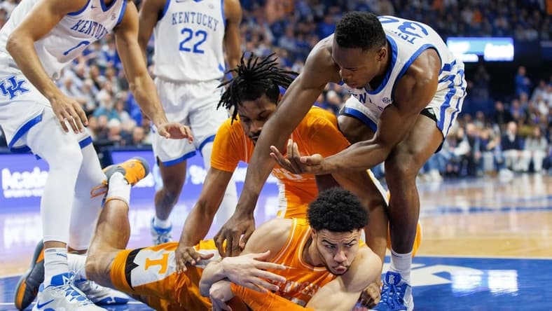 Feb 18, 2023; Lexington, Kentucky, USA; Tennessee Volunteers forward Olivier Nkamhoua (13) goes to the floor with the ball during the first half against the Kentucky Wildcats at Rupp Arena at Central Bank Center. Mandatory Credit: Jordan Prather-USA TODAY Sports